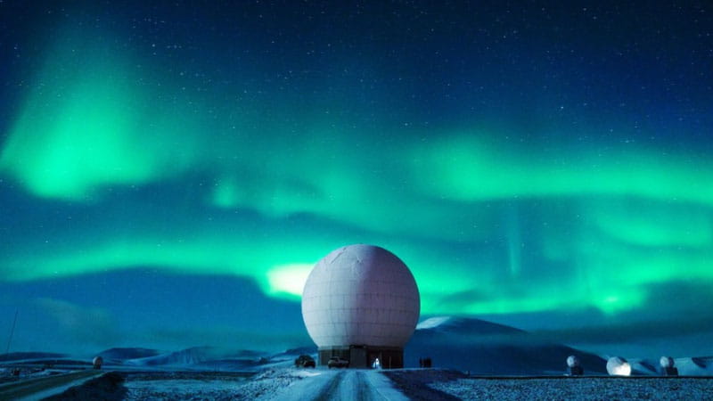 Night sky aurora over station