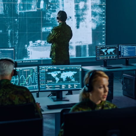 Military personnel at computer stations
