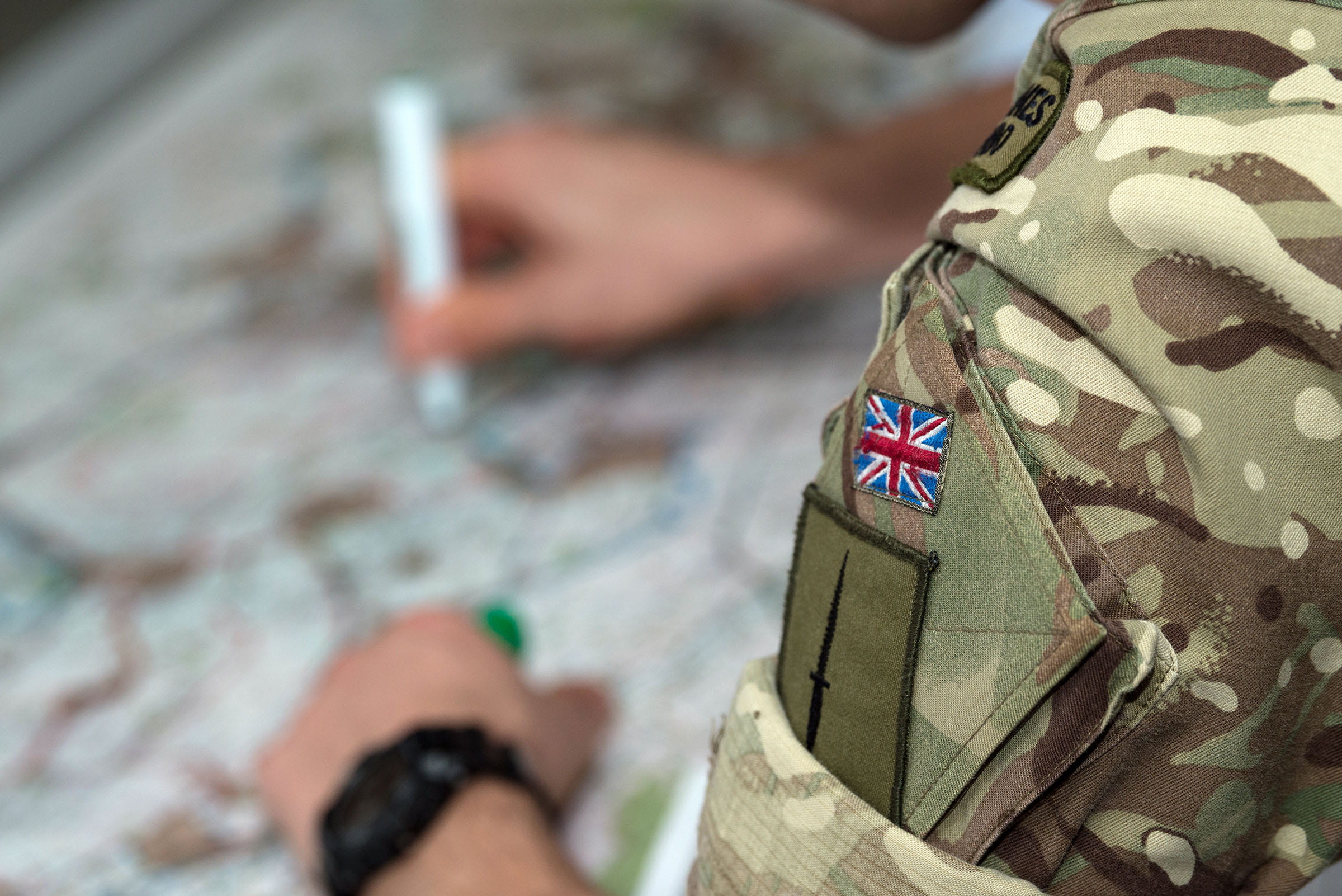 A 40 Commando Royal Marine plots positions on a map during the UK’s biggest annual training exercise to prepare troops for Chemical, Biological, Radiological and Nuclear (CBRN) operations. (Crown Copyright)