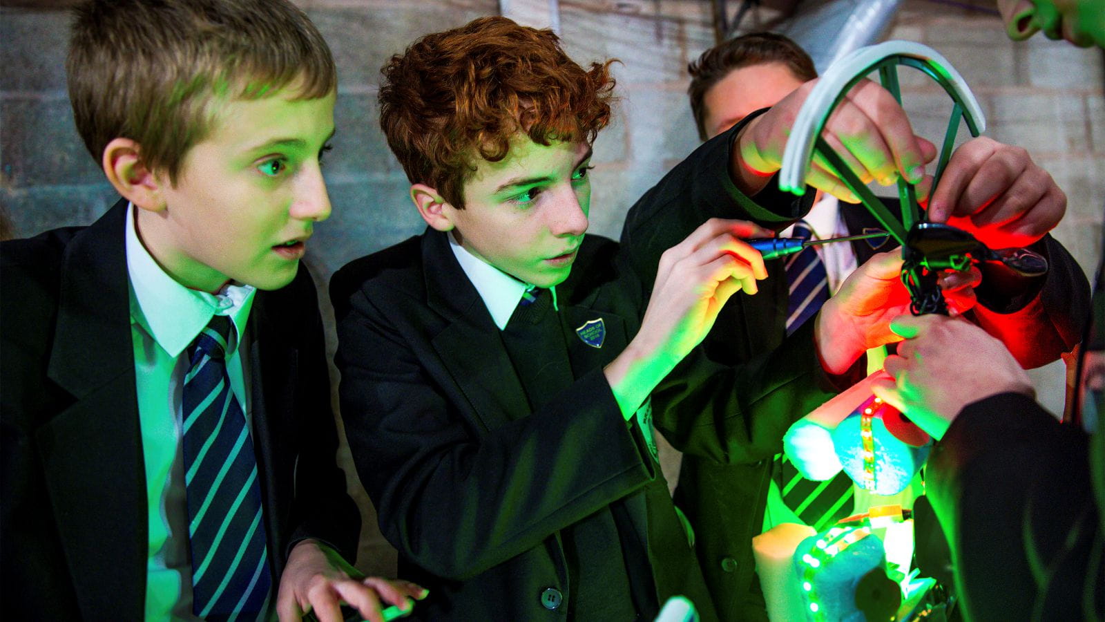 Students working on a machine