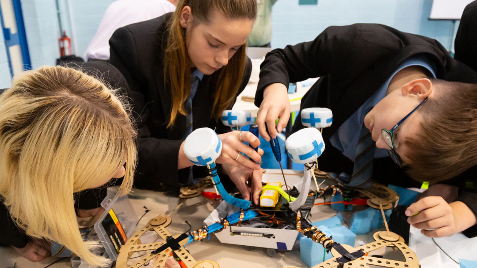 Students building a machine