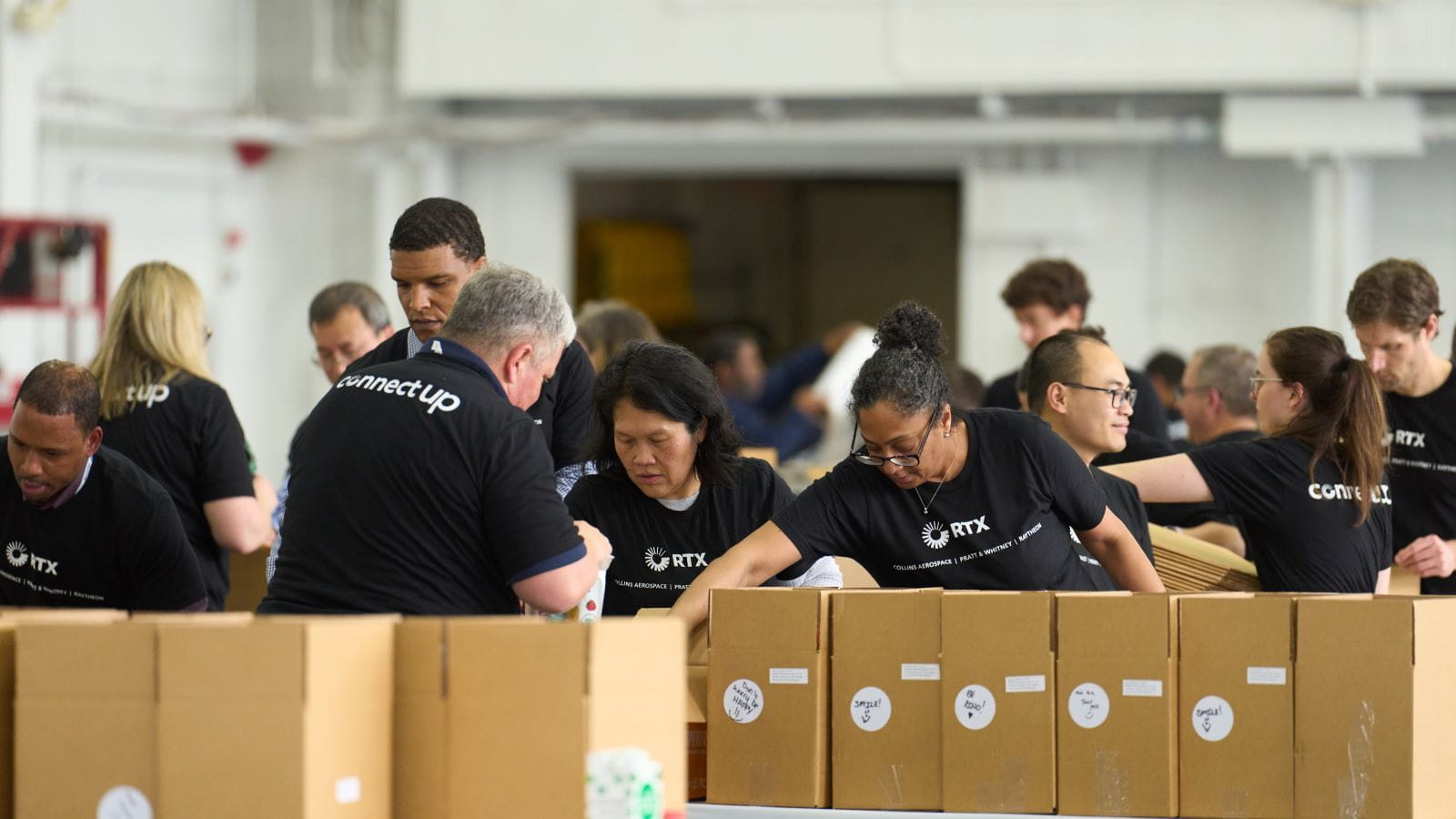 Volunteers filling donation boxes