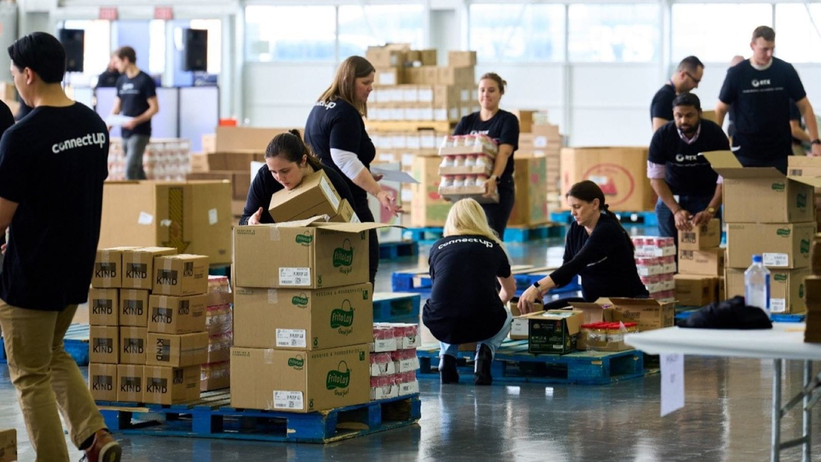 People filling boxes with donations