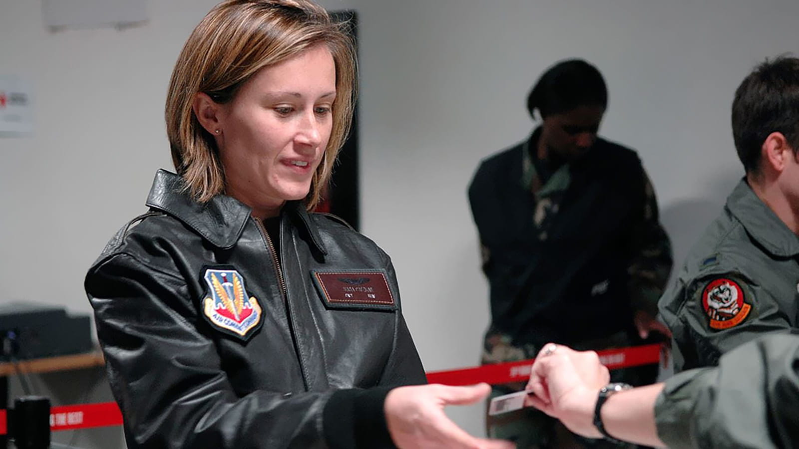 Woman being haded a business card