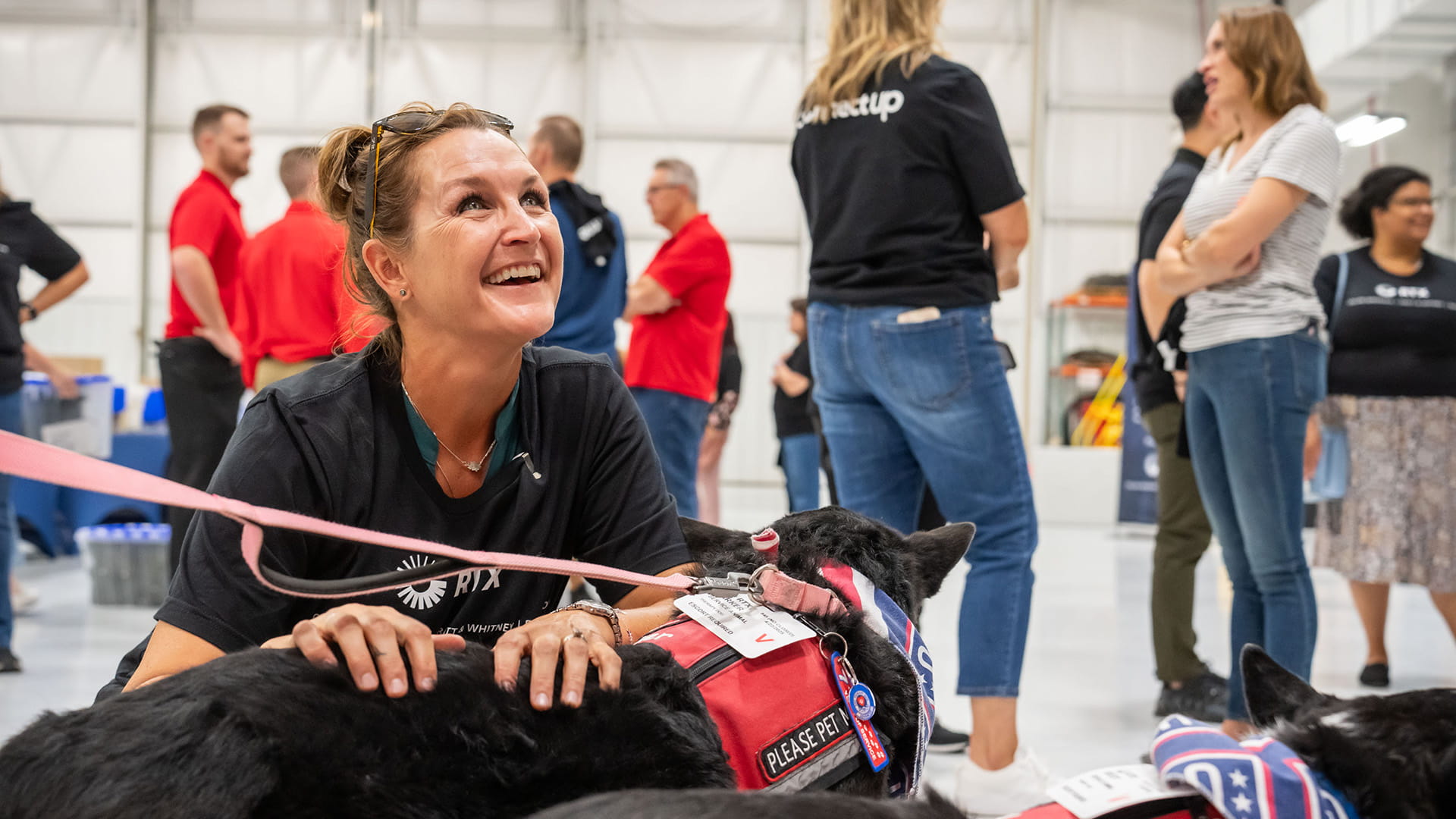 woman petting a service dog