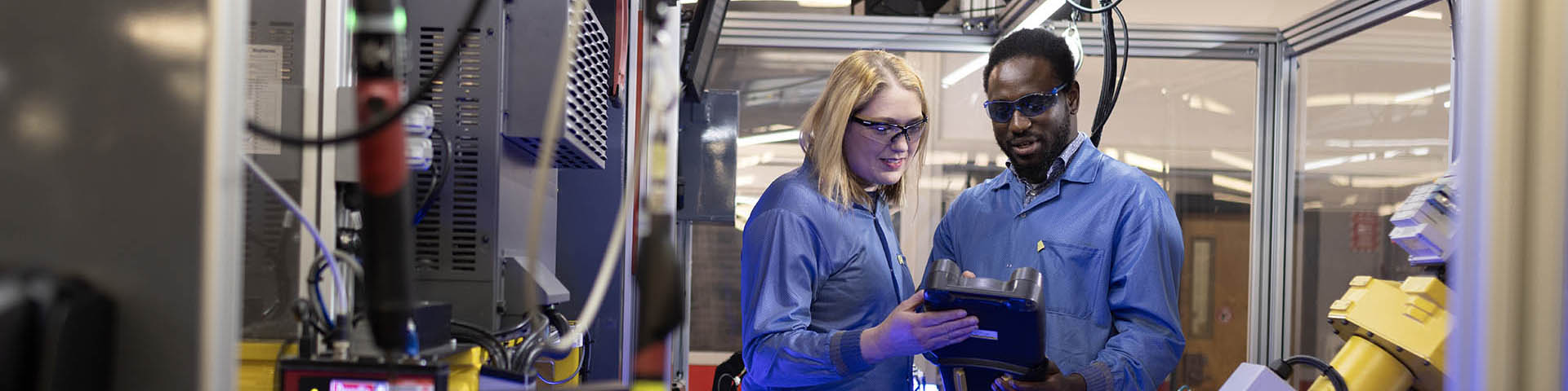 two people at work in a robotics lab