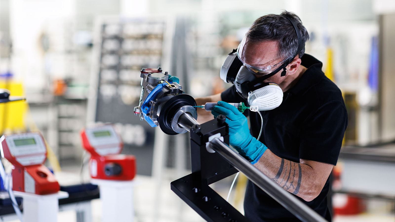 A Collins Aerospace technician applies sealant to an actuator part of the A350 electric thrust reverser system