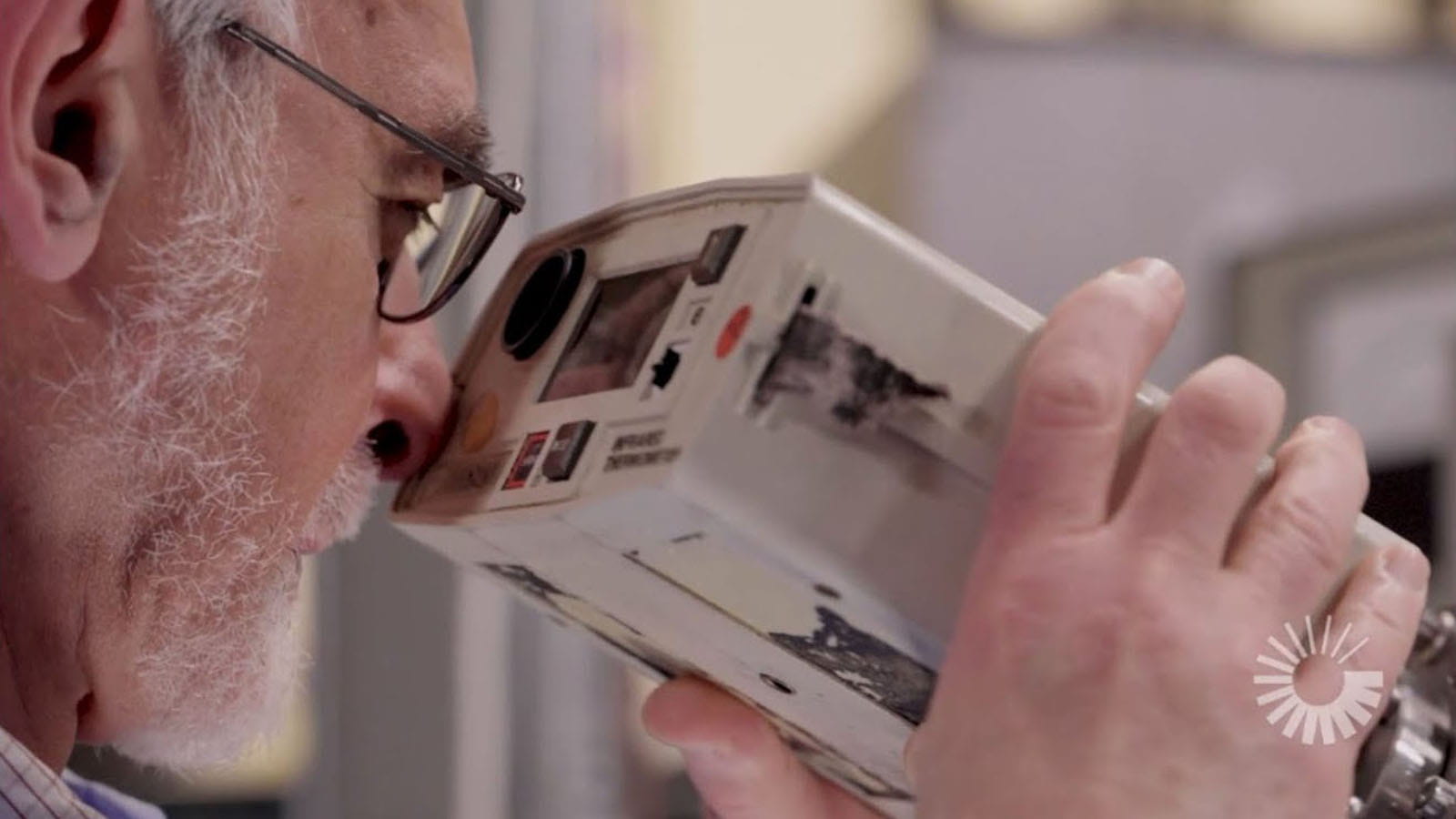 engineer looking into an instrument