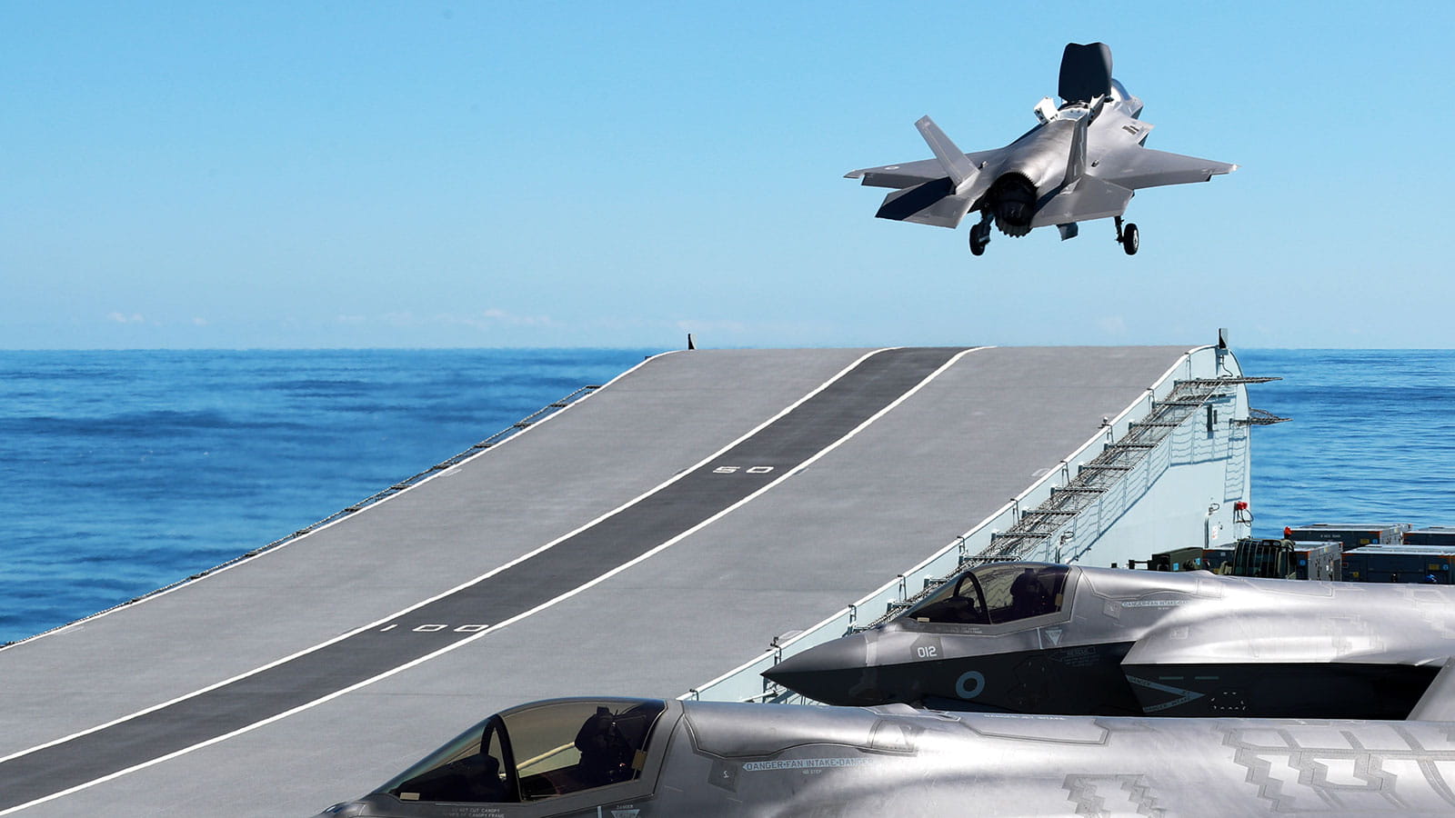 Plane taking off of an aircraft carrier