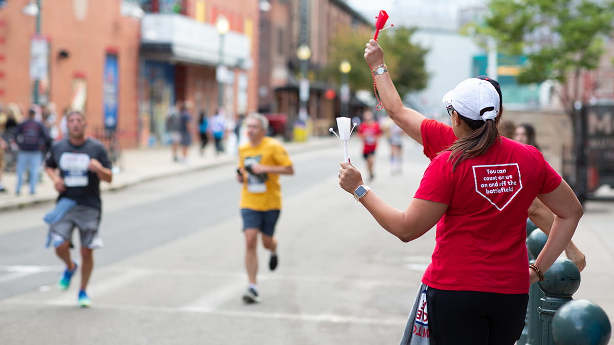 Raytheon Technologies volunteers worked at water stops and cheered on participants along the 9K/5K course that started and ended at Fenway Park. (Photo: Courtney Ryan)