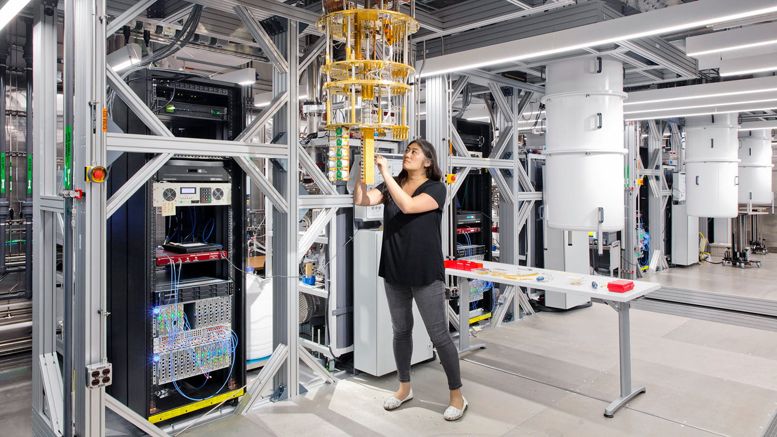 Woman working on IBM Q Dilution Refrigerator