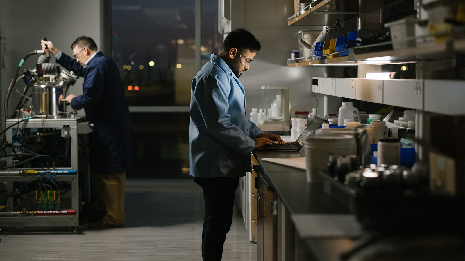 two reasearch scientists in a laboratory