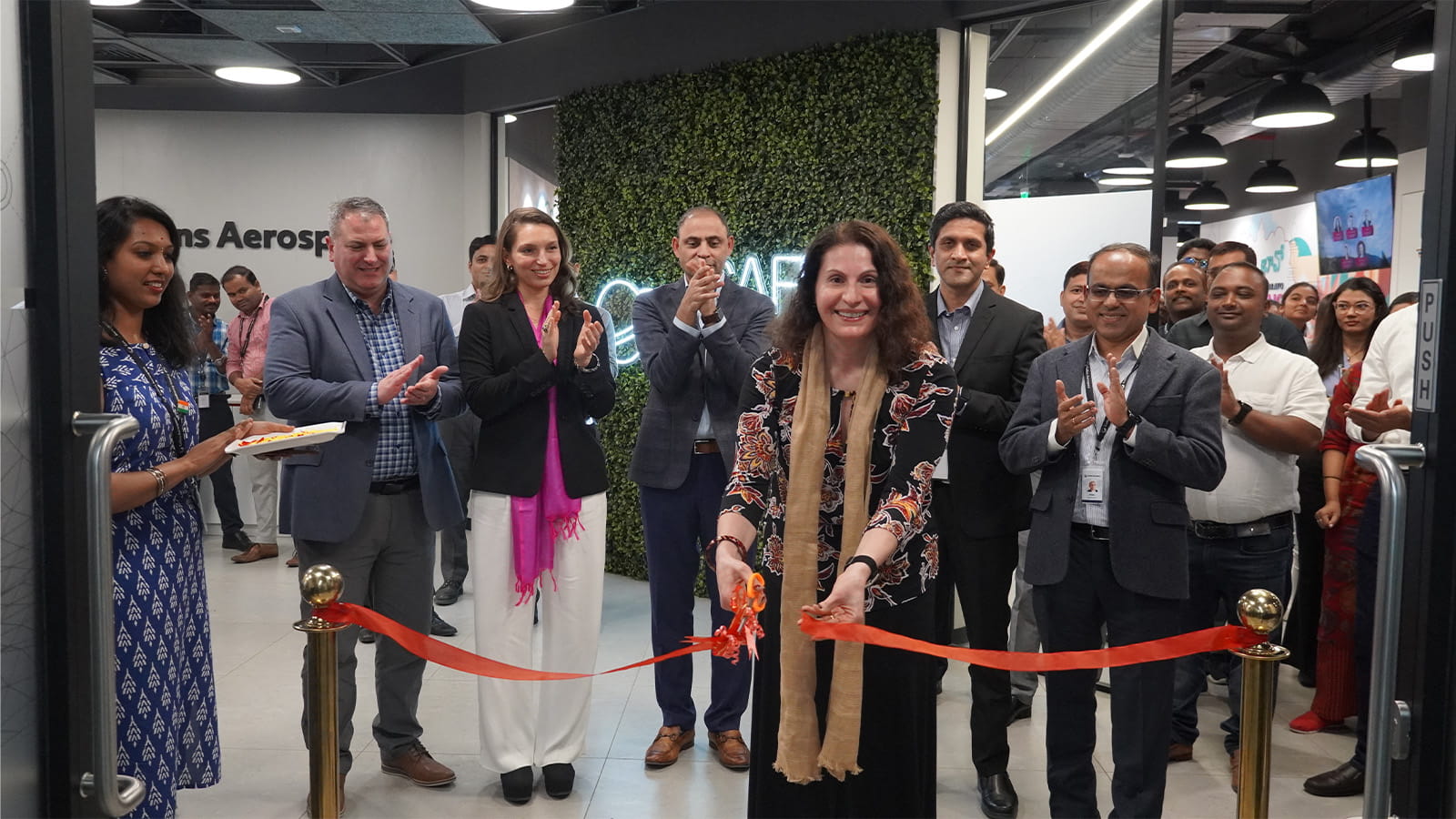 Collins Aerospace Chief Information Officer (CIO) Mona Bates cuts the ribbon during the inauguration of the India Digital Technology Center in Bengaluru