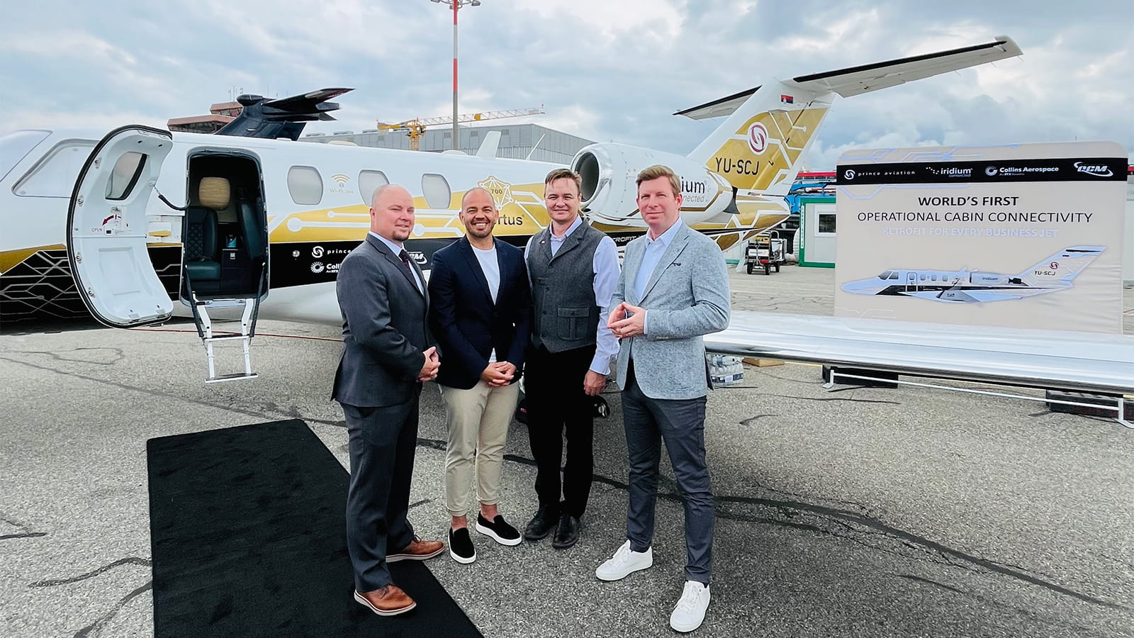 From left to right:  Nathan Voight, Vice President and General Manager, Business and Regional Avionics at Collins Aerospace Srdjan Kragojevic, Technical Director, Prince Aviation  Christian Schusser, CEO of QCM Design GmbH  John Peterson, Executive Director of Aviation, Iridium