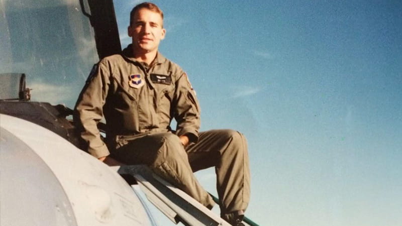 Dale “Chaos” Hetke on an F16 ladder