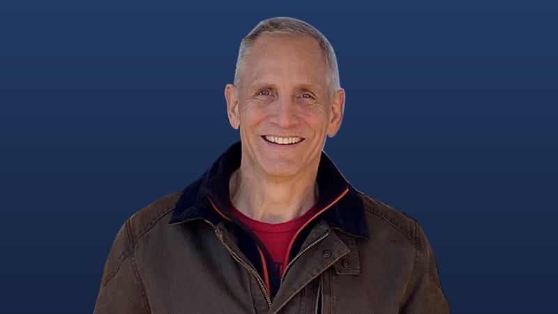 Joe Beissner profile image on blue background