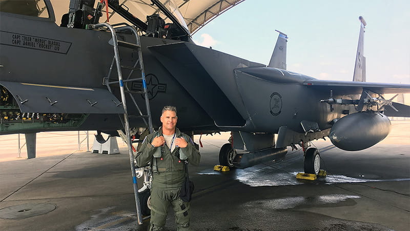 Nick "JDAM" Graham next to an F15