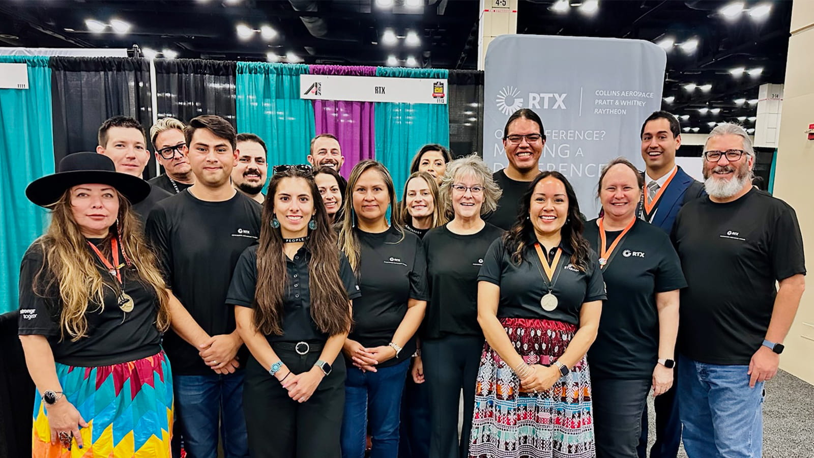 Members of RTX RAIN gather at the 2024 American Indian Science & Engineering Society conference career fair.