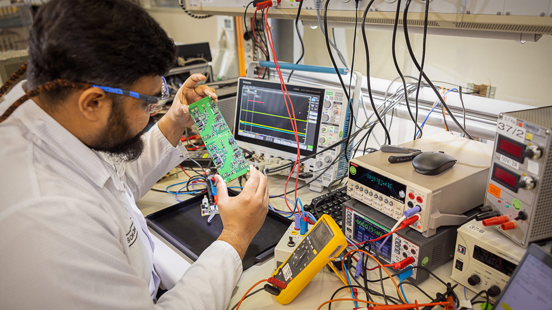 Employee running voltage test