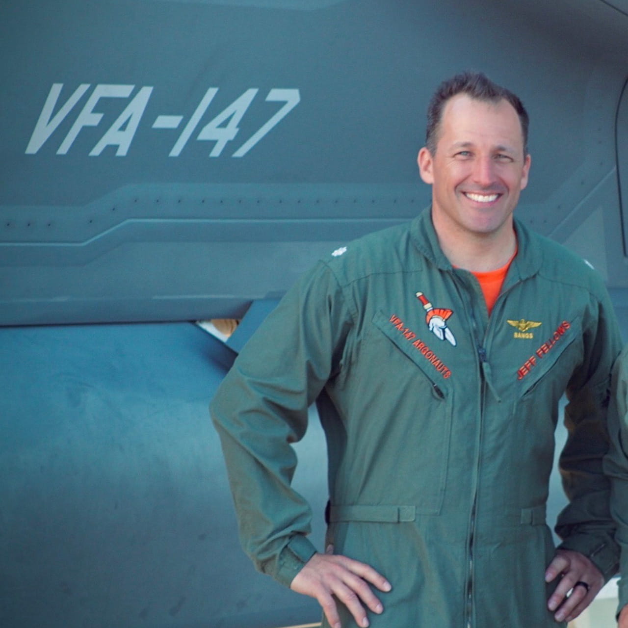 Jeff fellows in front of aircraft in flight suit