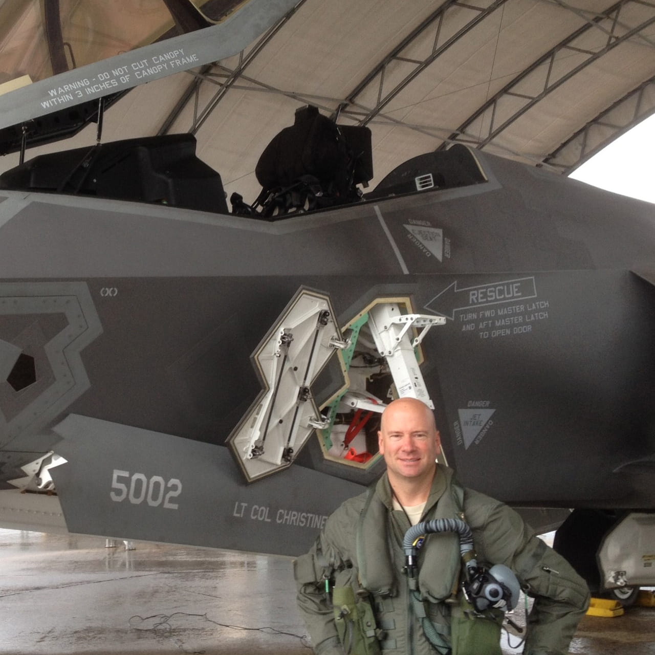 Ted Dempsey in front of F35 in hangar