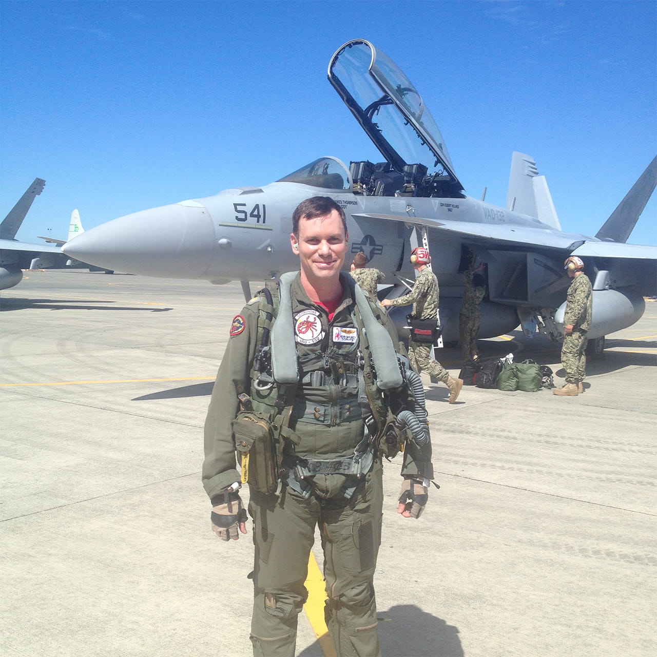 Kevin McCarty, a former electronic warfare officer in the U.S. Navy who now works at Collins Aerospace, stands in front of an EA-18G Growler