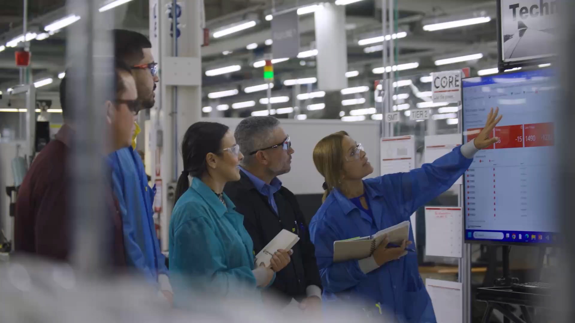 Engineers at site looking at a display