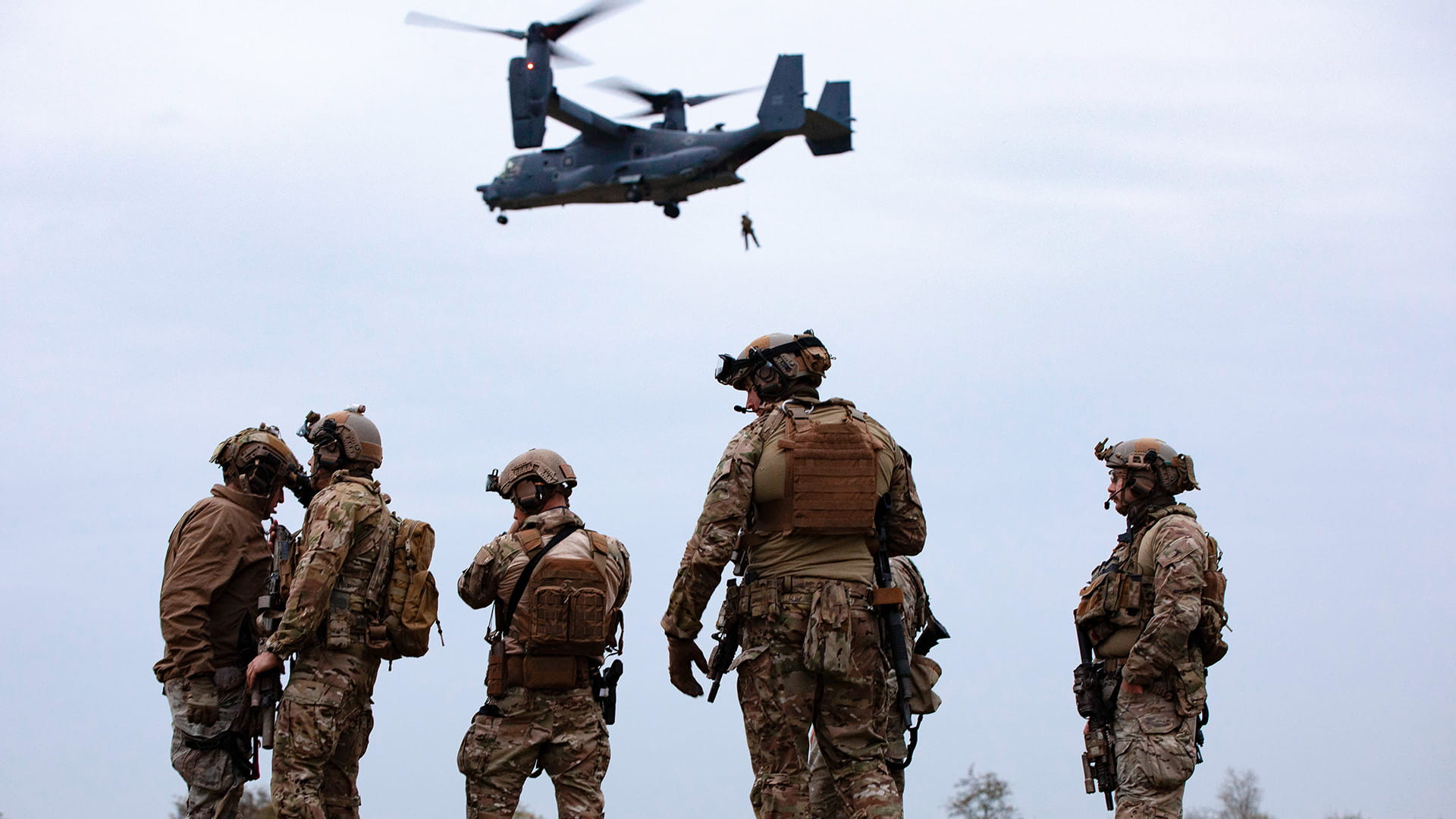 Troops repelling from VTOL aircraft