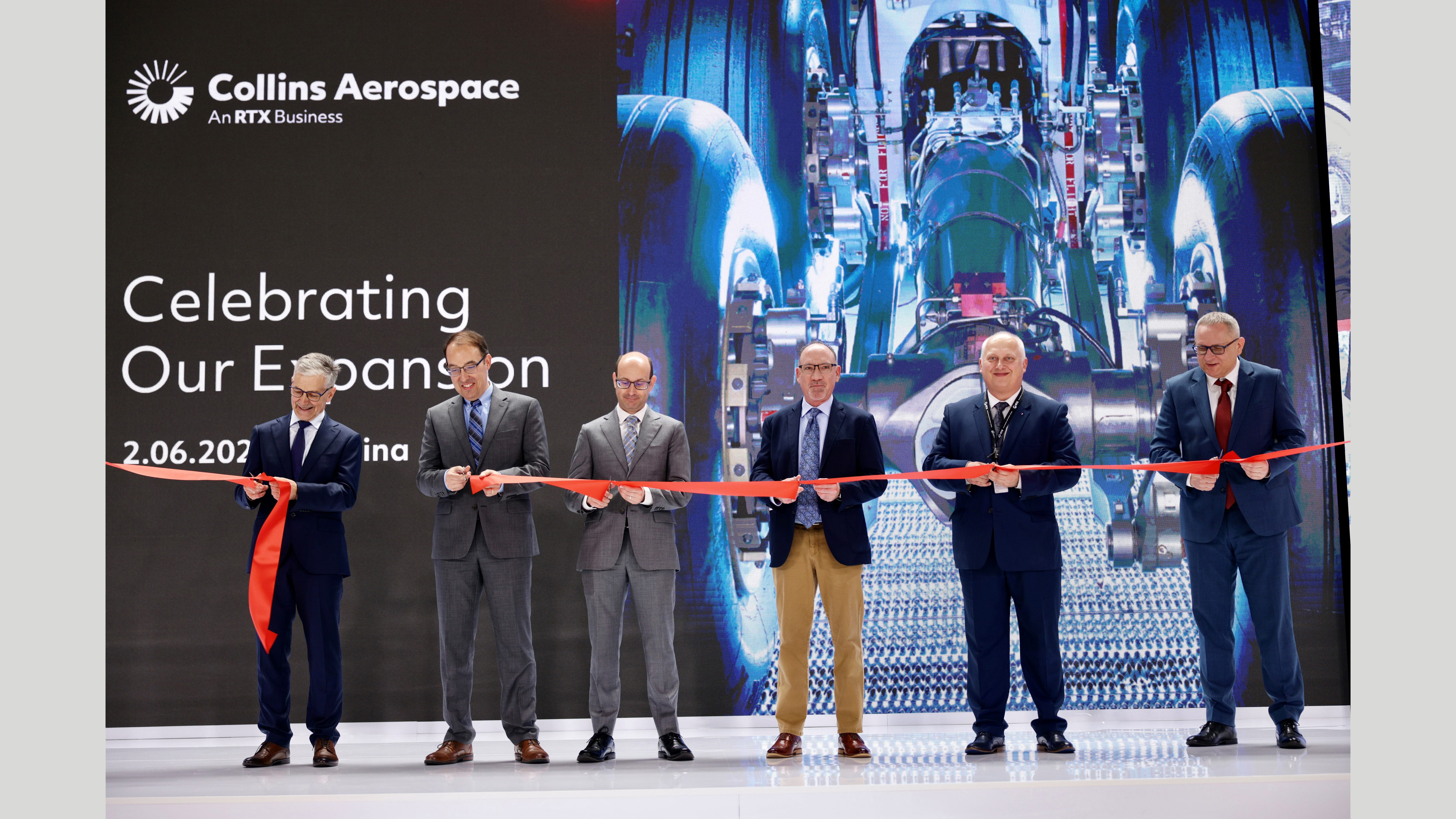 Executives at a ribbon cutting ceremony