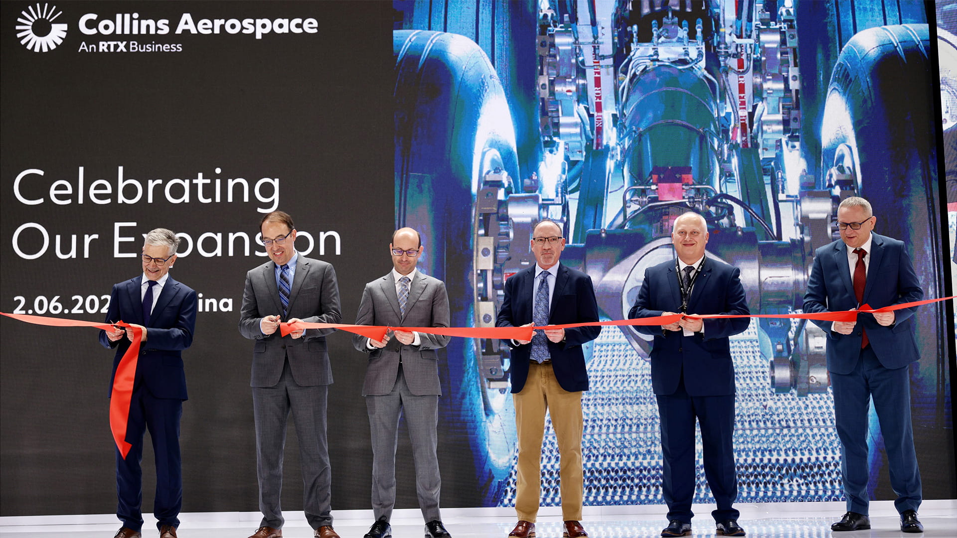 Executives at a ribbon cutting ceremony