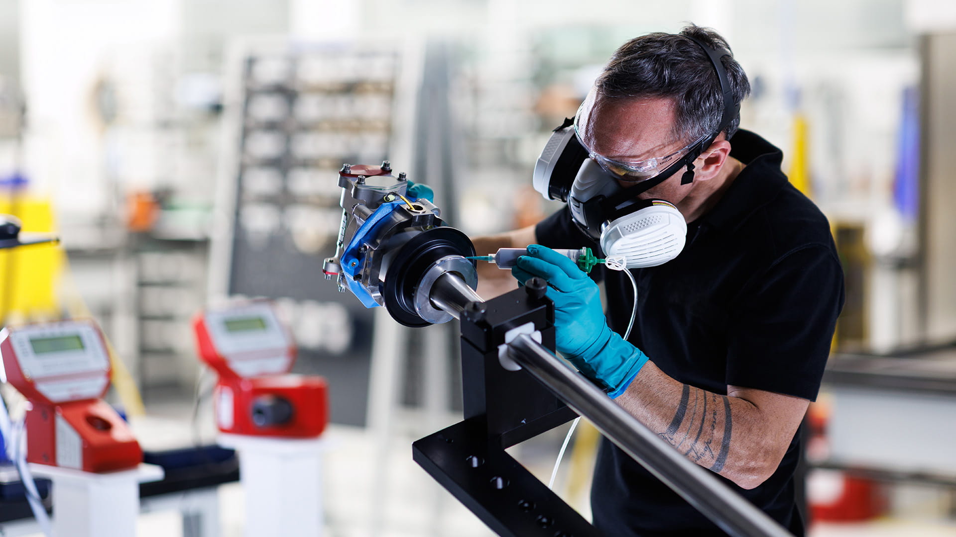 A Collins Aerospace technician applies sealant to an actuator part of the A350 electric thrust reverser system (elecTRAS) on the new production line in Colomiers, France