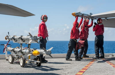 Sailors remove an AIM-9X® SIDEWINDER® air-to-air missile from an F/A-18F Super Hornet on the flight deck of the of the U.S. Navy’s only forward-deployed aircraft carrier, USS Ronald Reagan (CVN 76). (Photo: U.S. Navy)
