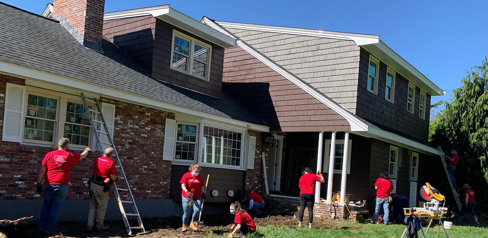 Raytheon employees volunteering at Ironstone Farm.