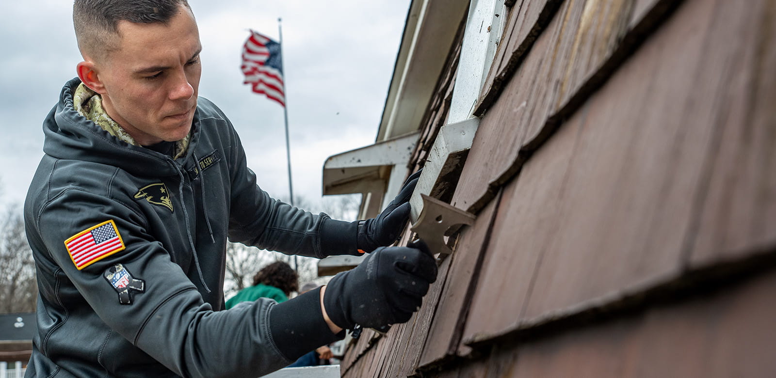 Raytheon employees volunteering at Ironstone Farm.
