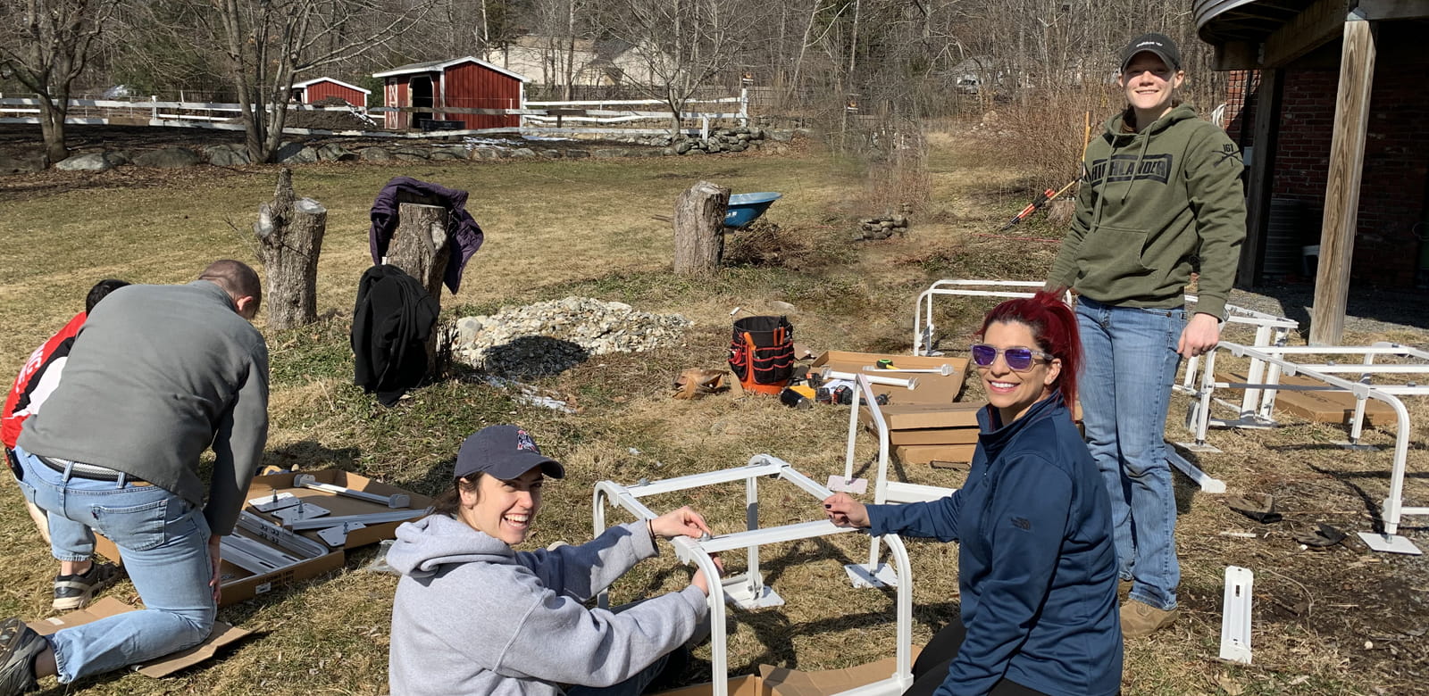 Raytheon employees volunteering at Ironstone Farm.