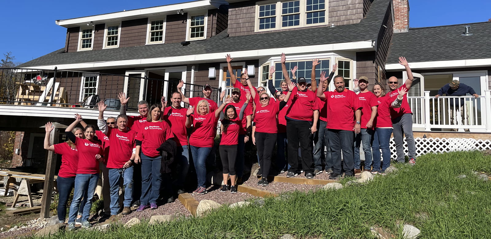 Raytheon employees volunteering at Ironstone Farm.