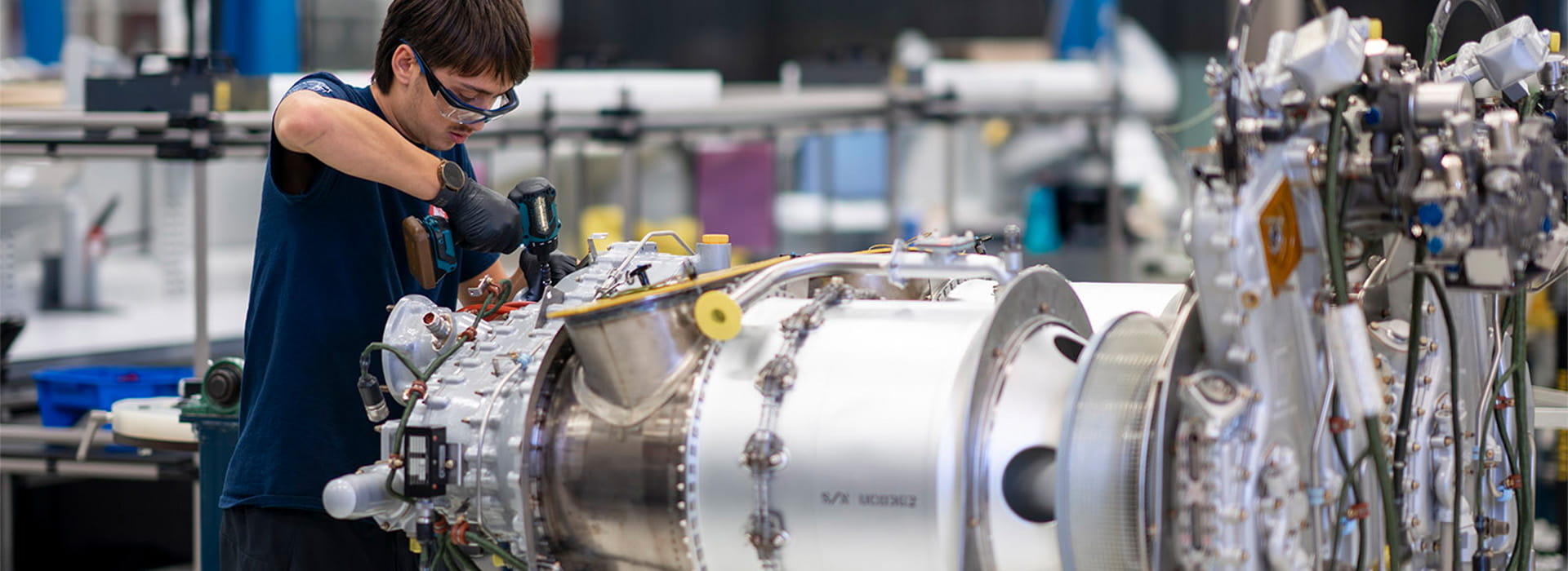 PWC employee working on engine