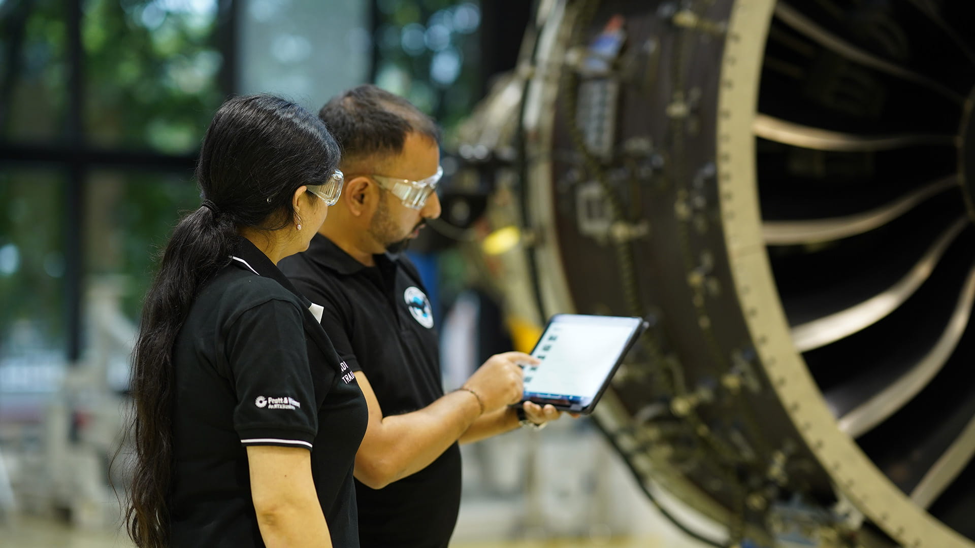 P&W employees inspecting engine