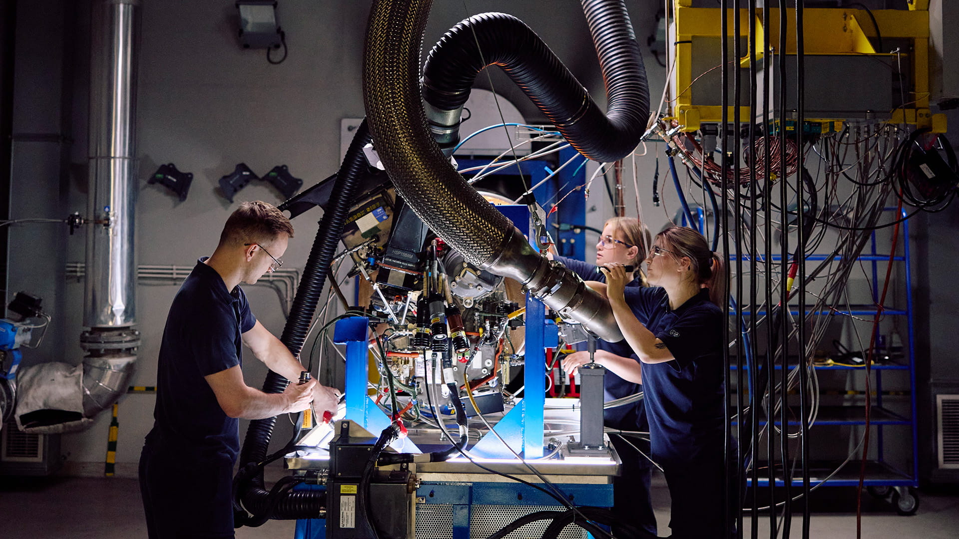 3 employees at a work table