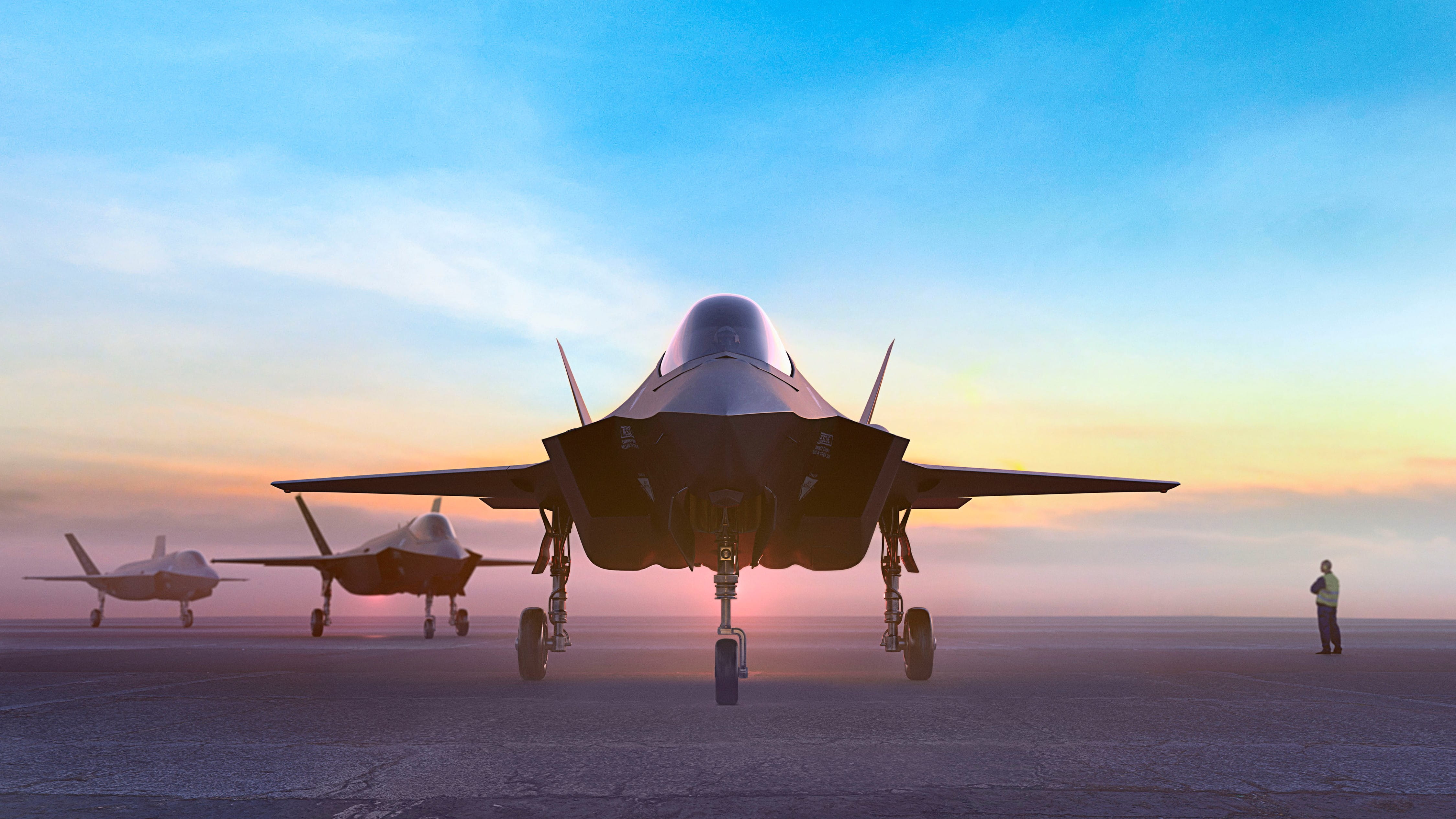 A line of military aircraft with a man patrolling their movement