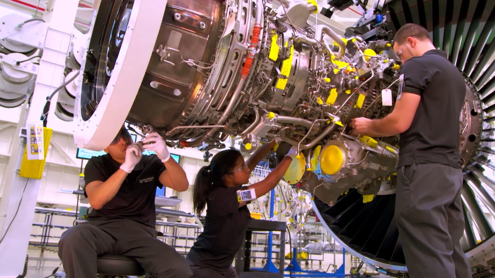 Techs working on P&W engine