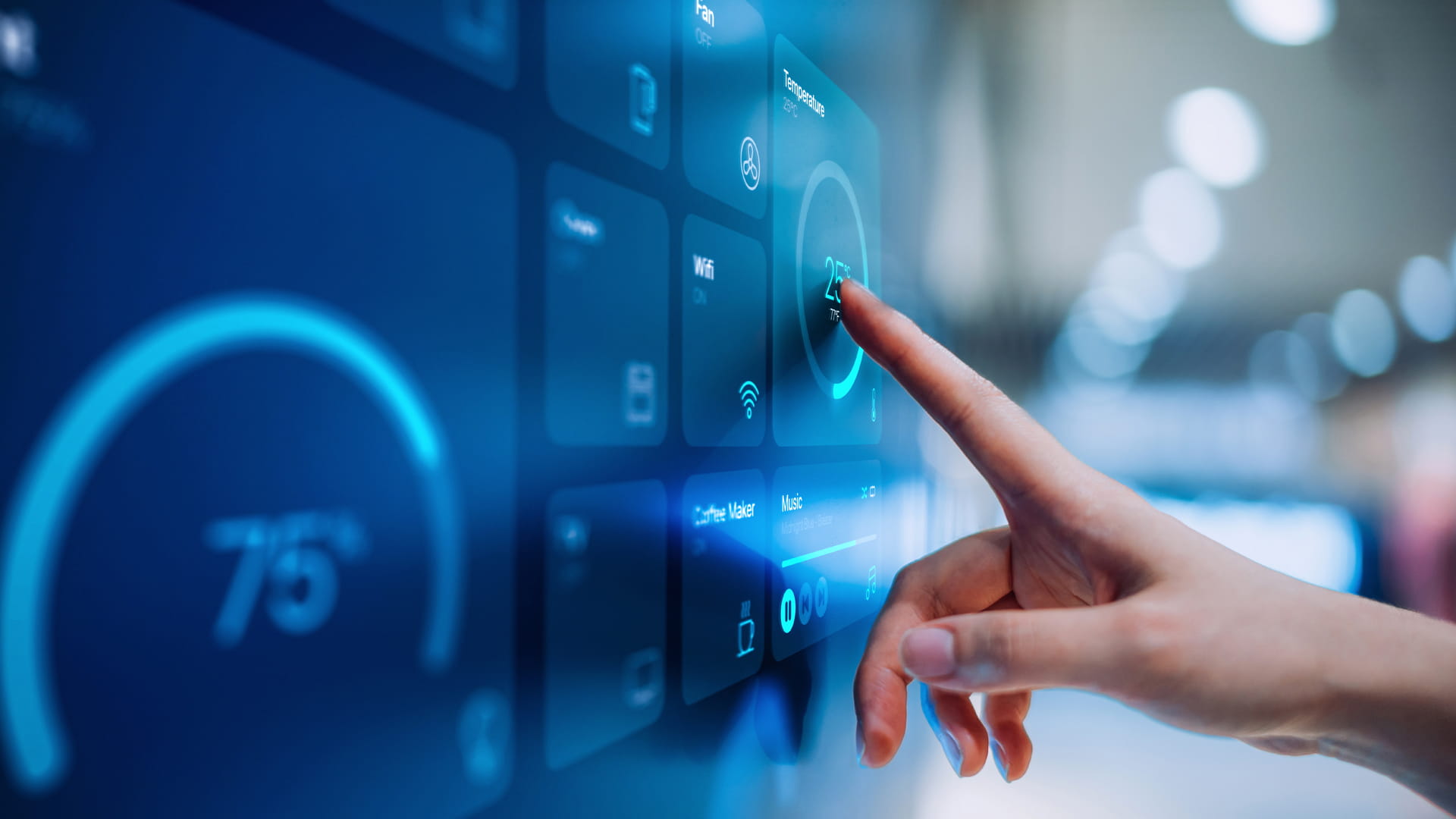 Up-close view of a hand adjusting temperature via digital touch screen.