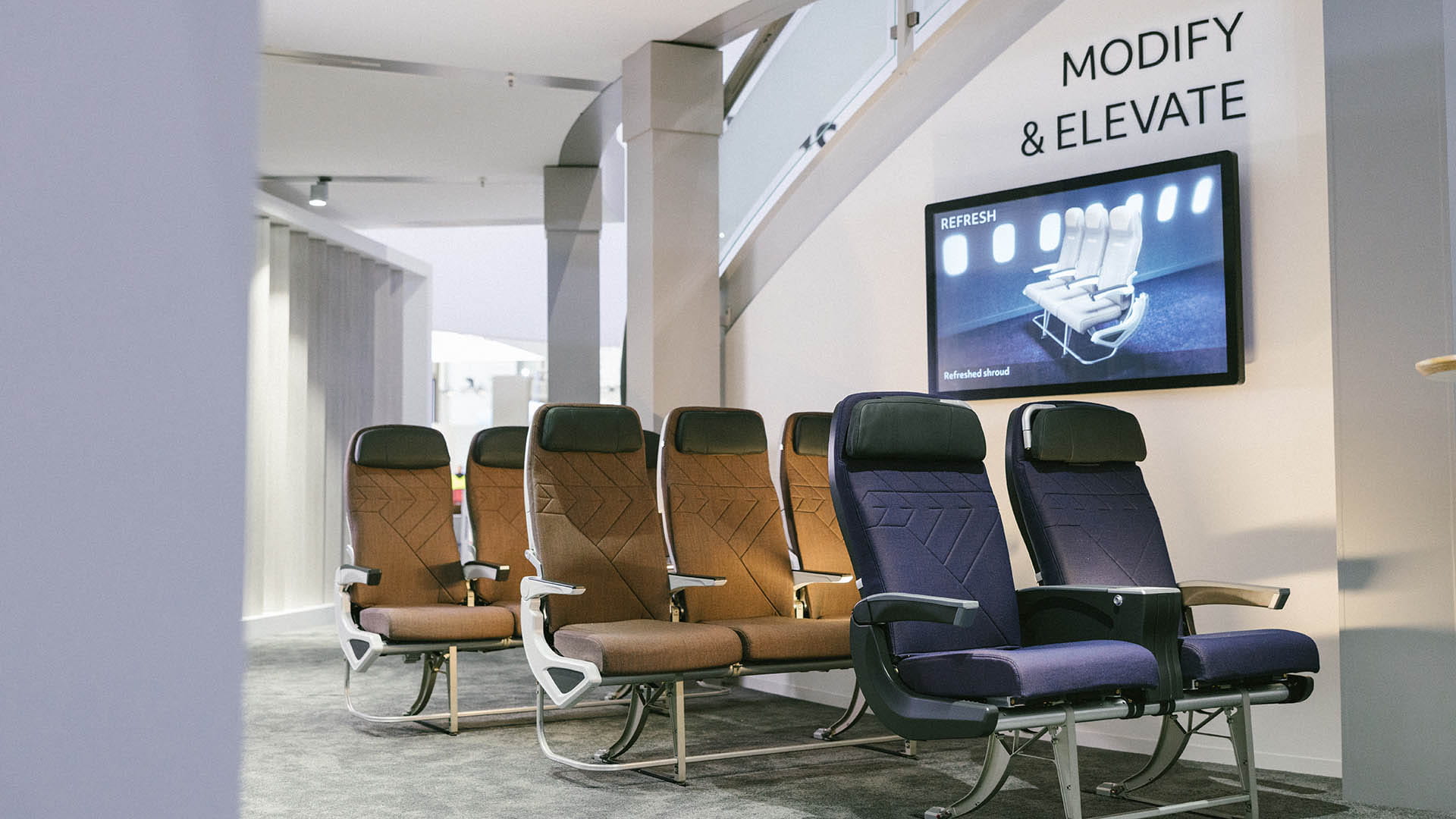 passenger aircraft seats on display at a tradeshow