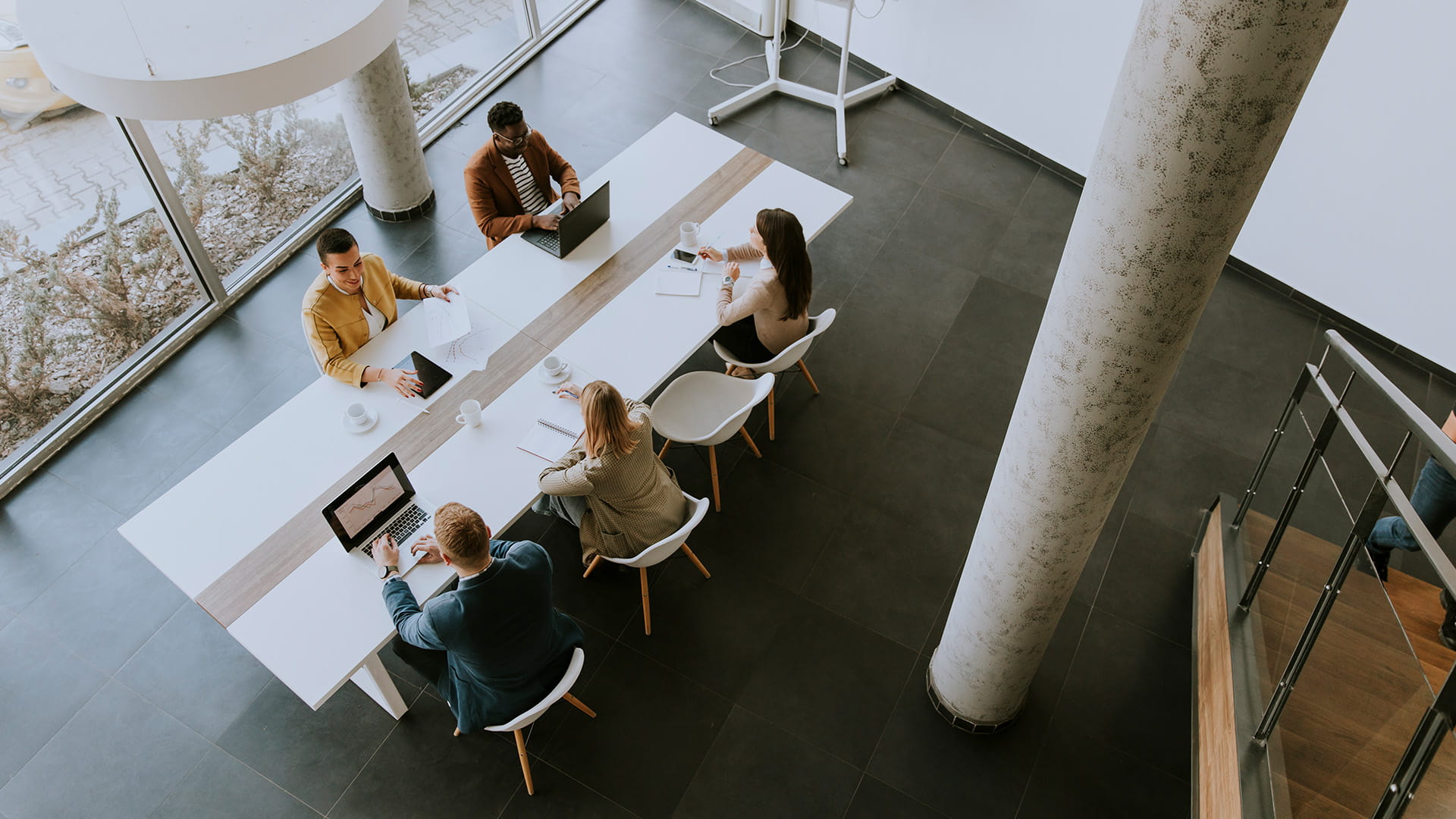 Overhead view of people at a work table