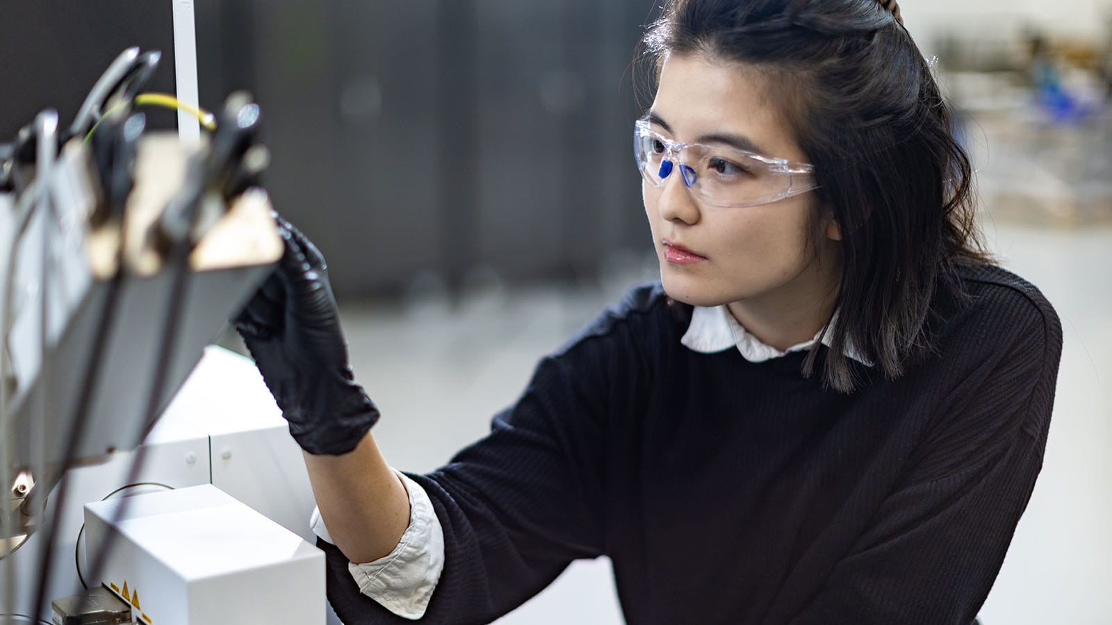 Woman engineer wearing protective goggles