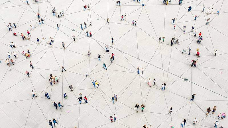 People walking on a surface with lines connecting them like a web