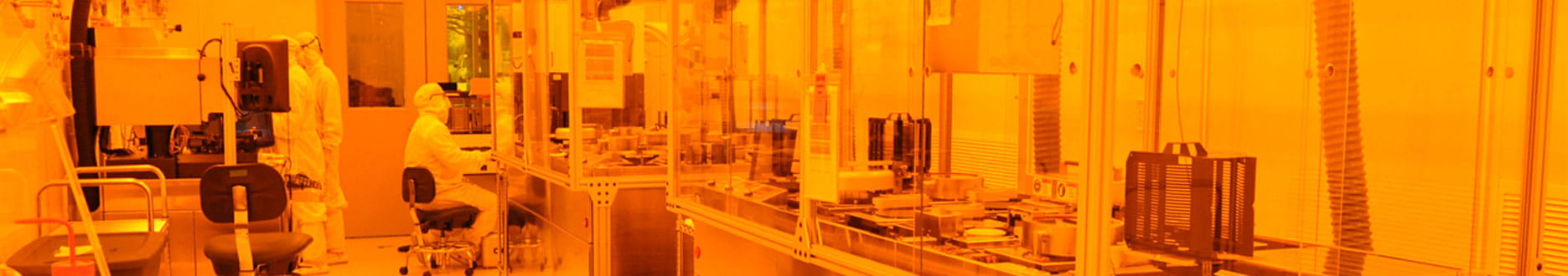 technicians in a lab wearing full coverings