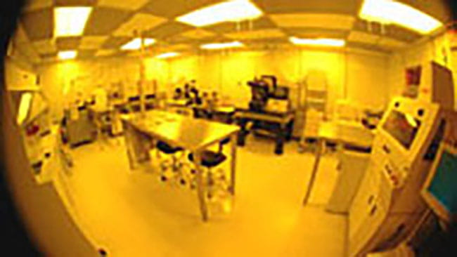 a room with a table and computers