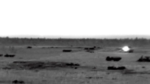 bright light on tank in field