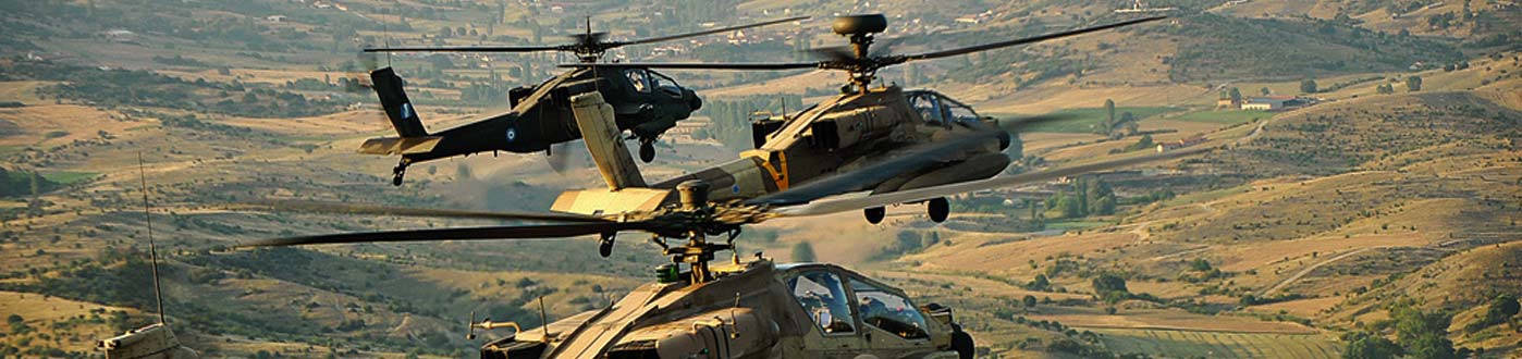 A fleet of military helicopters flying over rural territory